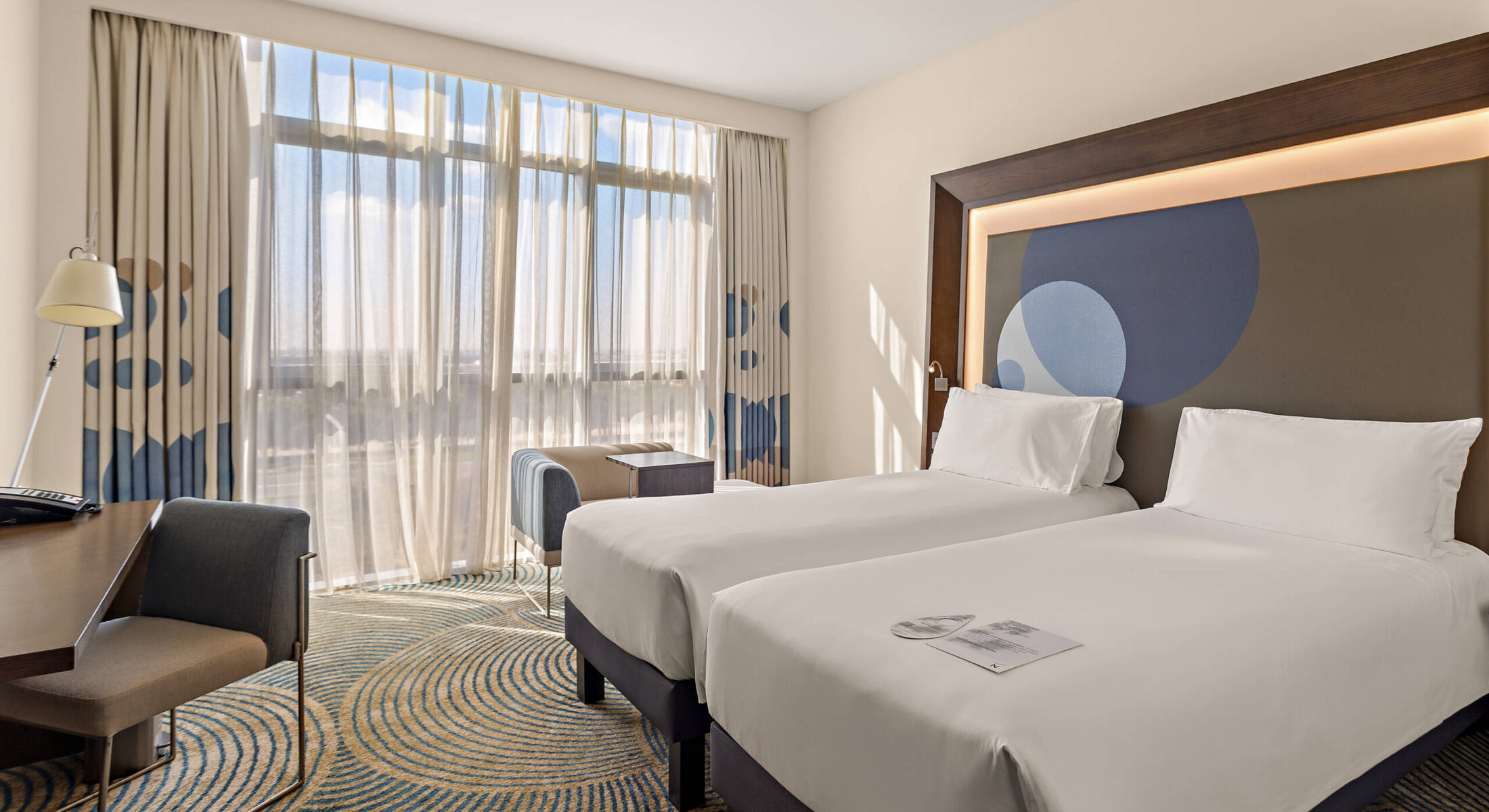 Hotel near Yas Superior Room twin beds at Novotel Gate Abu Dhabi with modern design and canal view