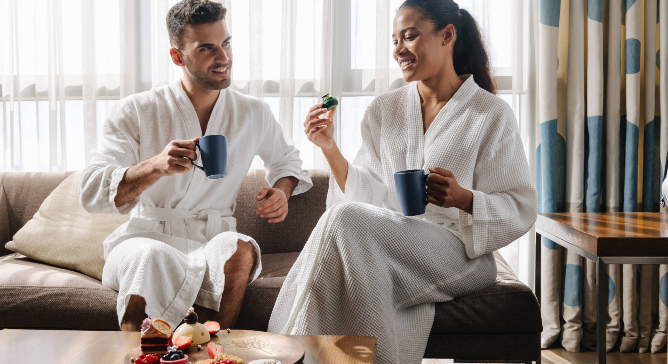 Hotel near Yas Superior Room with couple enjoying coffee and pastries at Novotel Gate Abu Dhabi