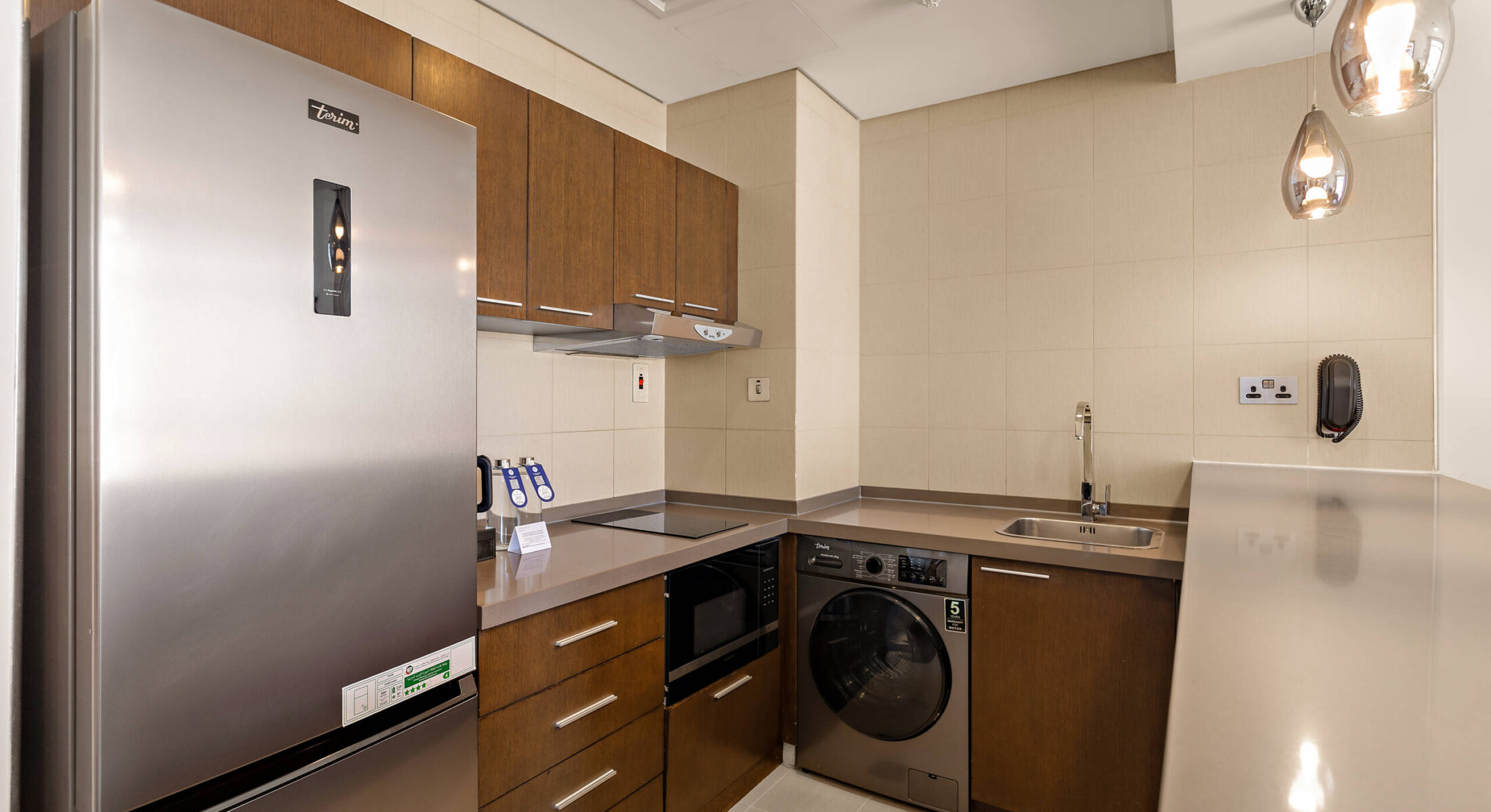 Fully equipped kitchen in one-bedroom apartment near Grand Mosque Abu Dhabi