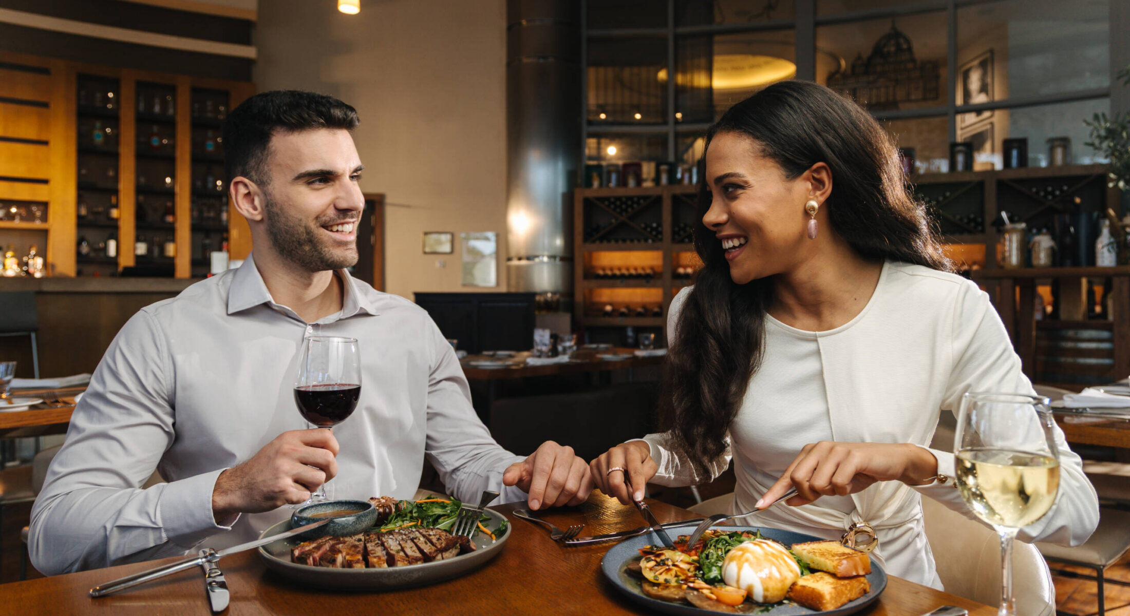 Couple enjoying dinner at Gabbiano Italian dining restaurant in Abu Dhabi