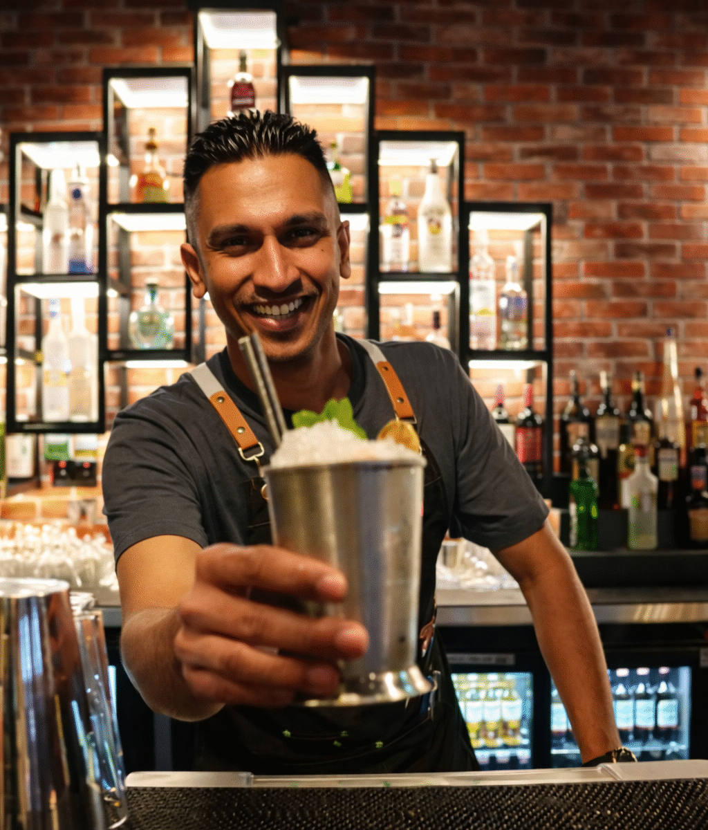Guests watching live football match at Tiki Taka sports bar in Novotel Gate Abu Dhabi with indoor shisha and burgers
